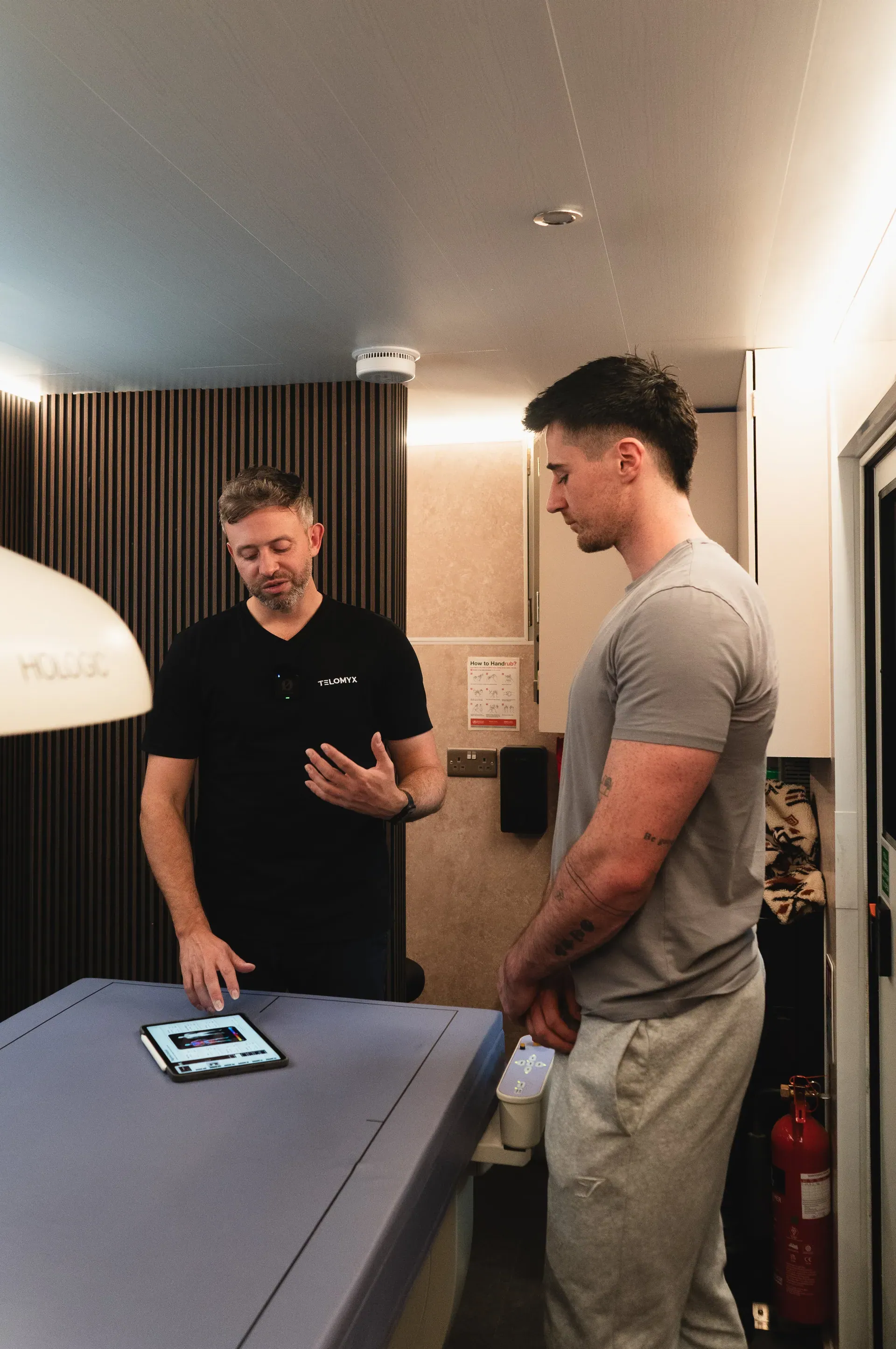 A man being consented for a Telomyx DEXA body composition scan